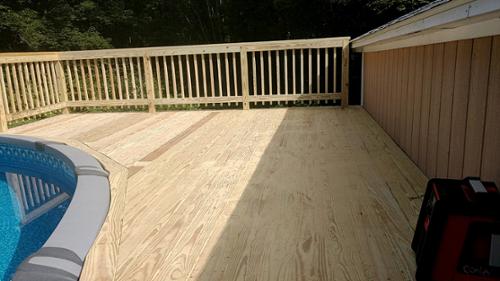 Deck wrapped around above ground pool