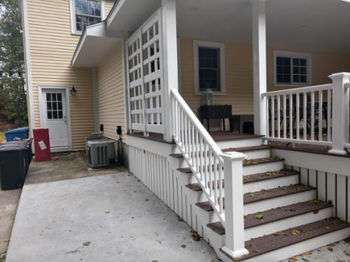 Side of deck stairs with custom privacy lattice.